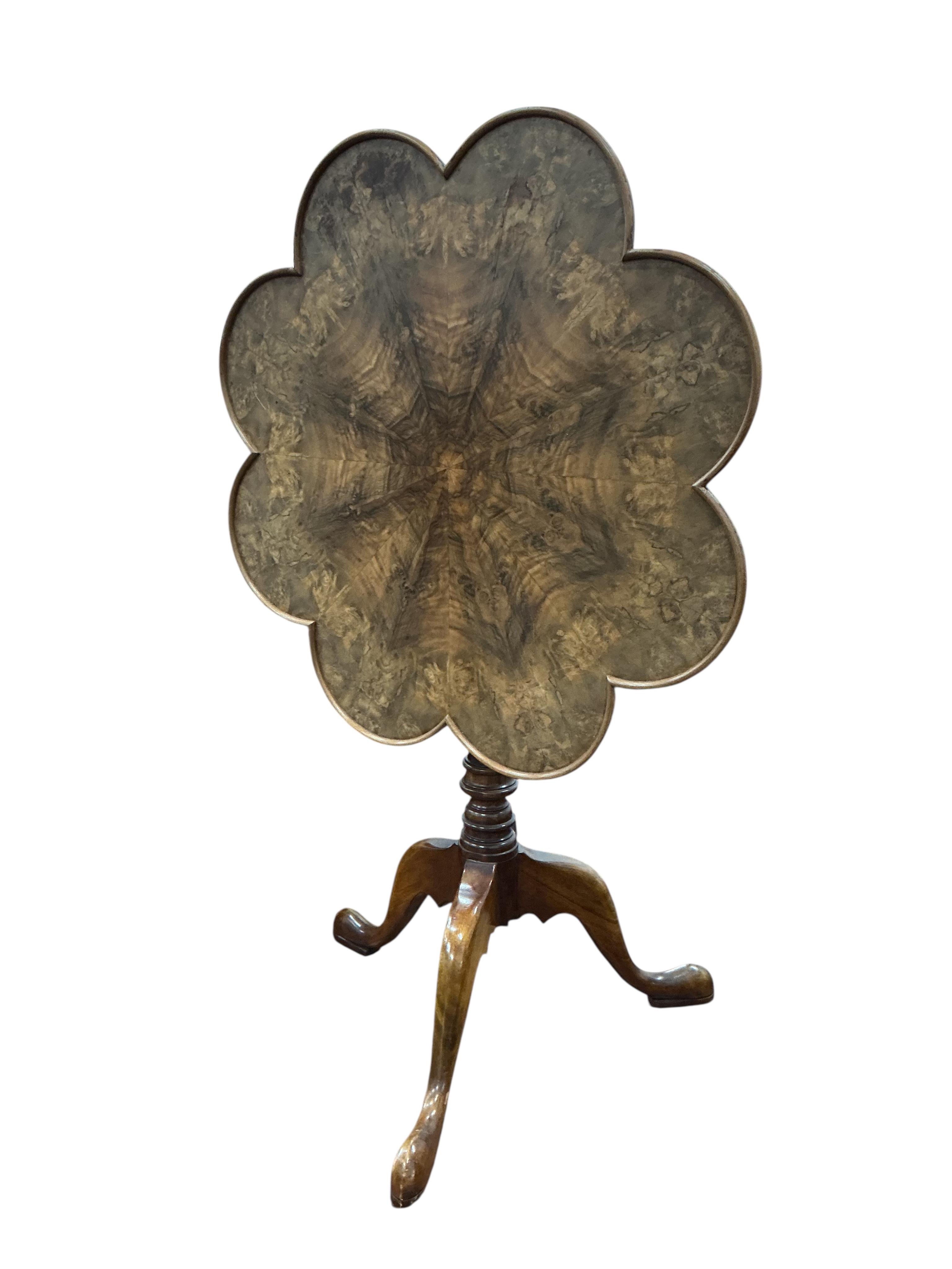 A reproduction mahogany tilt top tripod tea table, diameter 67cm, height 66cm